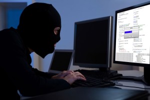 hacker-downloading-information-off-a-computer