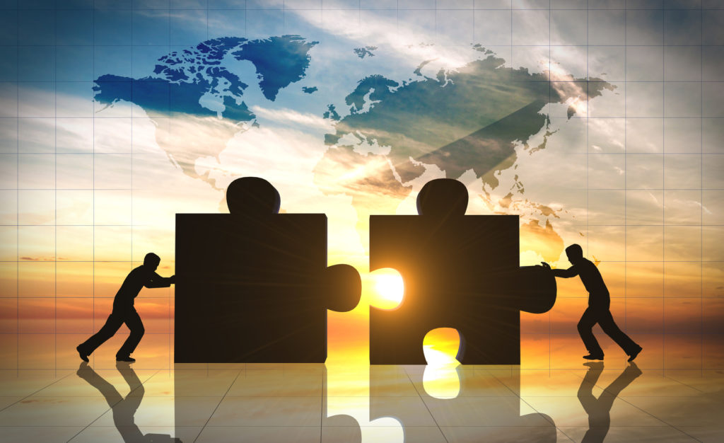 World Business teamwork puzzle pieces