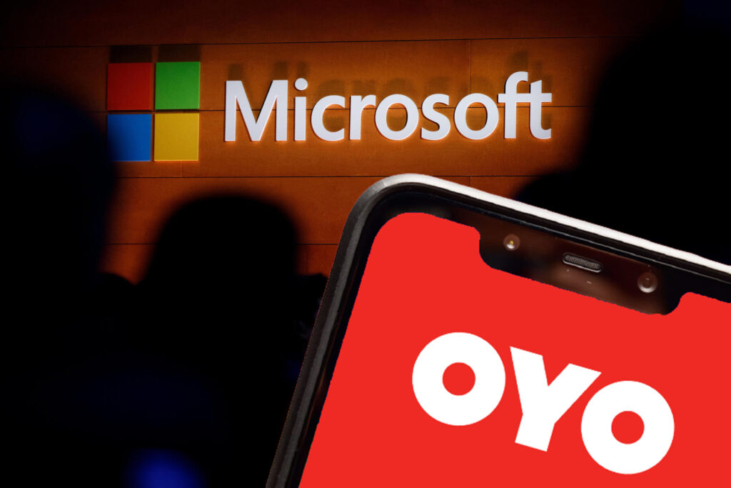 The Microsoft logo is illuminated on a wall during a Microsoft launch event to introduce the new Microsoft Surface laptop with OYO Rooms logo on Poco F1