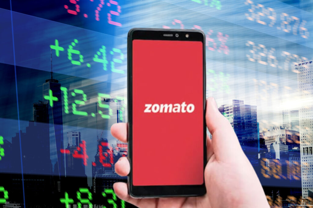 Zomato logo on a Smartphone; Abstract office Buildings and Trading Screen Data