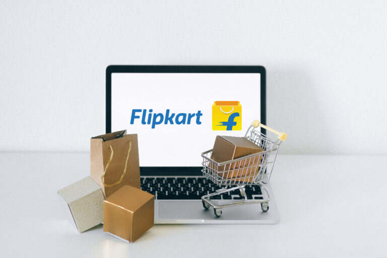 Brown Cardboard Box on Stainless Steel Shopping Cart Flipkart logo on Laptop