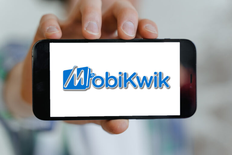 Smartphone in Hand representing Mobikwik logo