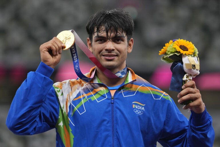 Gold medalist Neeraj Chopra poses during the medal ceremony for the men's javelin throw at the 2020 Summer Olympics in Tokyo