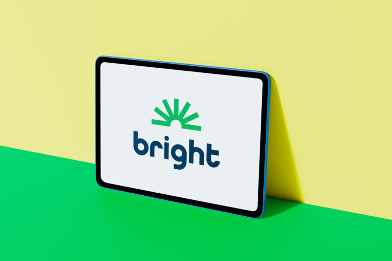 Bright Money logo displayed on colorful digital tablet