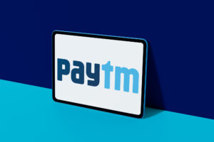 Paytm logo displayed on colorful digital tablet