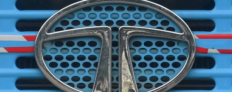 Tata Motors logo is seen on the engine grille of a truck