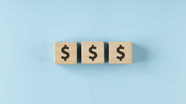 Dollars on wooden cubes arrangement