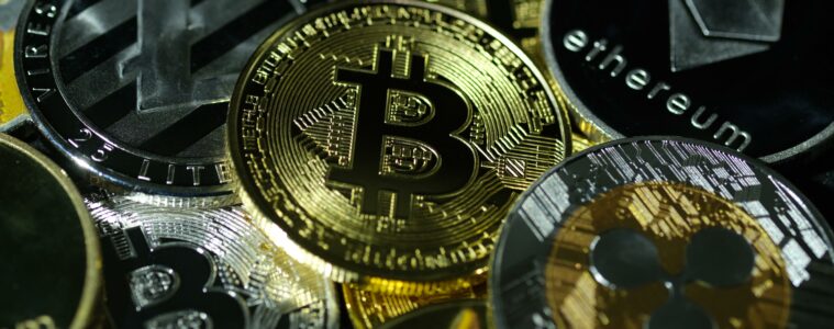 visual representations of digital cryptocurrencies, Bitcoin (BTC), Ethereum (ETH), Ripple (XRP), Litecoin (LTC) and Dogecoin (DOGE)