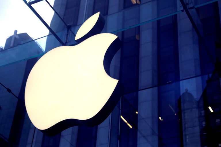 Apple Inc logo is seen hanging at the entrance to the Apple store on 5th Avenue in New York