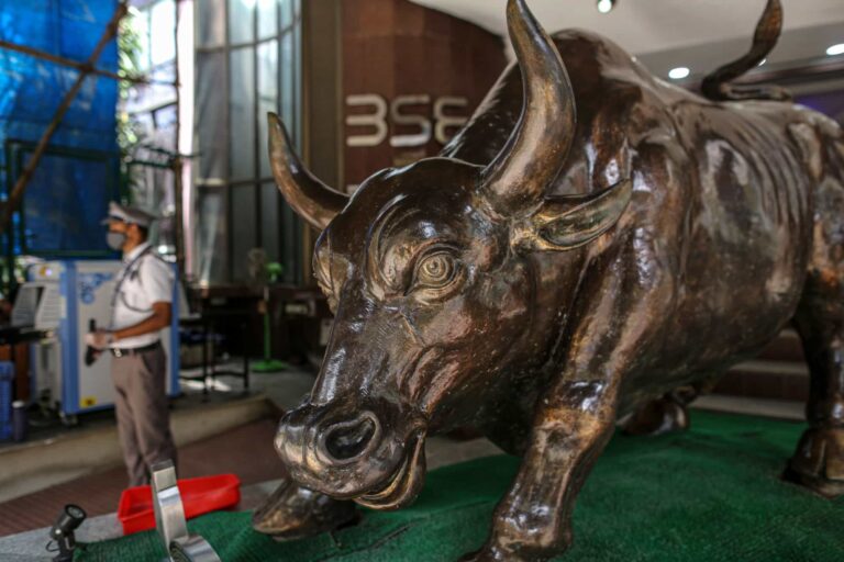 A bronze bull statue stands at the entrance to the Bombay Stock Exchange (BSE) building in Mumbai, India