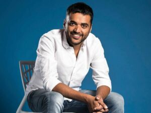 Photo of Zomato Founder and CEO Deepinder Goyal sitting on a chair