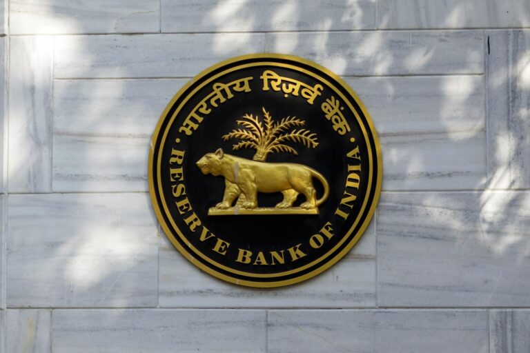 The Reserve Bank of India (RBI) logo is displayed outside the central bank in Mumbai, India