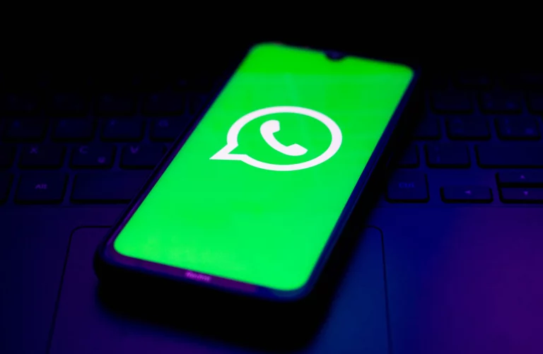 In this photo illustration the WhatsApp logo seen displayed on a smartphone