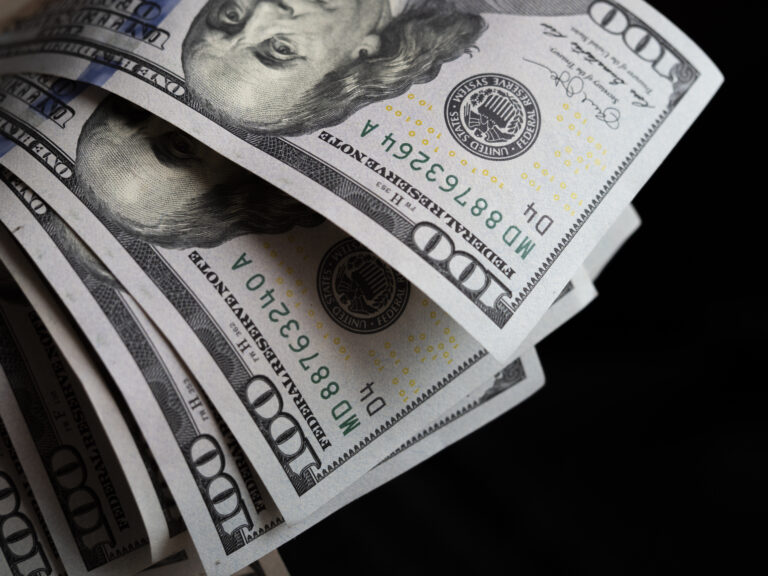 A photo illustration of US 100 dollar bills