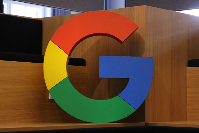 Google corporate logo stands at the Google Germany offices