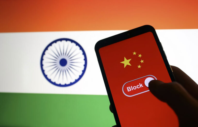 Indian flag is displayed on a laptop screen and a symbol of "block" and Chinese flag are displayed on a smart phone screen