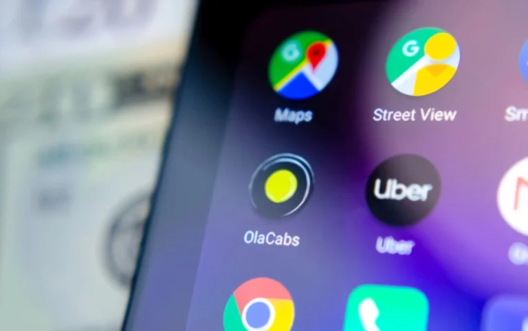 Uber and Ola Cabs app on the smartphone screen