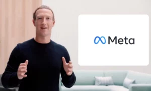 Zuckerberg stands alongside Meta banner