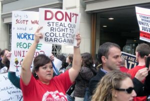 A crowd protesting against anti-union efforts