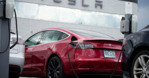 Image of a Tesla car inside a showroom