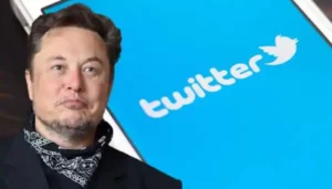 Image of Elon Musk with the logo of Twitter in the background