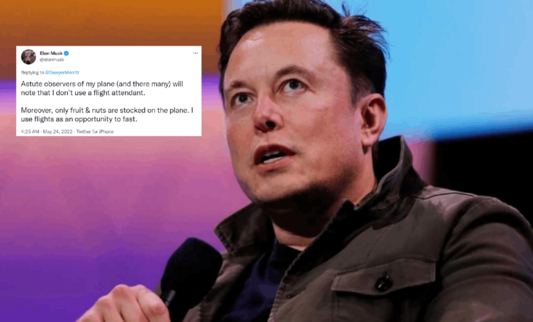 Elon Musk in an event with his tweet depicted on the side