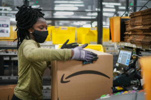 A worker at Amazon working following protocols for Covid