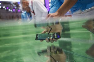 A visitor tests the waterproof S7 from Samsung at the 2016 IFA consumer electronics trade fair on August 3, 2016 in Berlin, Germany