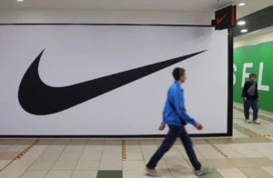 People walk past a closed store of the sporting goods retailer Nike at a shopping mall in Saint Petersburg, Russia May 25, 2022