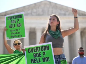 An activist protesting overturning of Roe v Wade