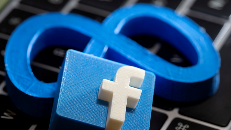 Facebook and Meta placed on a keyboard