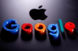 A 3D printed Google logo is placed on the Apple Macbook 