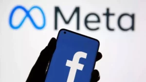 Meta logo depicted in front of Facebook logo