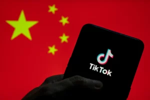 TikTok logo depicted against flag of China