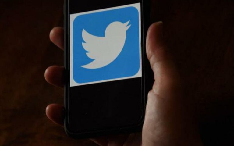 Twitter logo depicted on a screen