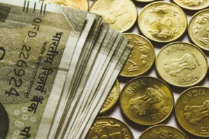 Image depicted Rupee notes and coins