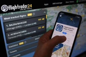 Flightrdar24 app seen on a screen in front of laptop