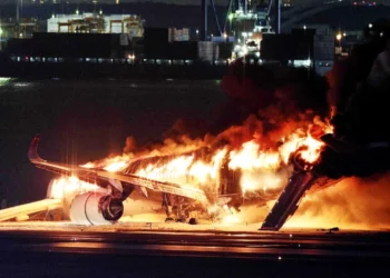 plane engulfed in flames after colliding with coastguard aircraft