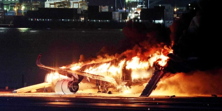 plane engulfed in flames after colliding with coastguard aircraft