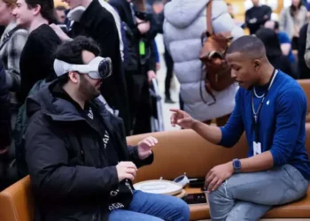 People using Apple Vision Pro Headsets attract reactions from others