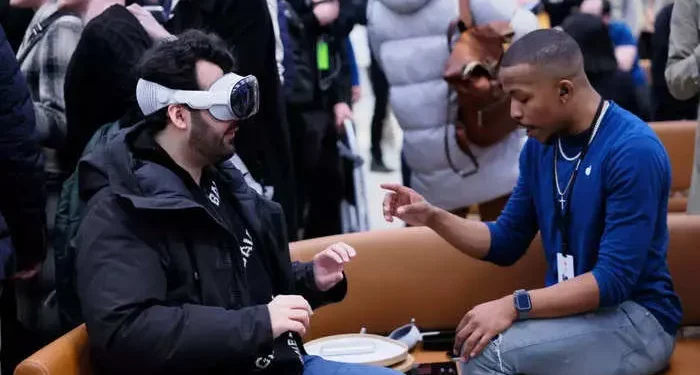 People using Apple Vision Pro Headsets attract reactions from others
