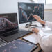 Stock exchange market concept, Business investor trading or stock brokers having a planning and analyzing with display screen and pointing on the data presented and deal on a stock exchange.