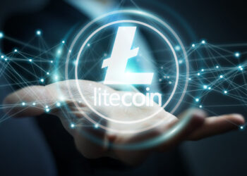 Businessman on blurred background using litecoins cryptocurrency 3D rendering