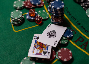 cards on a green cloth Casino table.