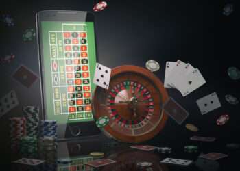 Online casino concept. Mobile phone, roulette with casino chips, slot machine and cards. 3d illustration
