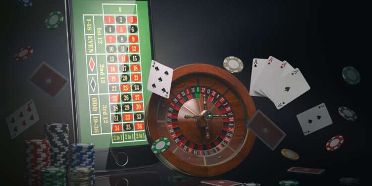 Online casino concept. Mobile phone, roulette with casino chips, slot machine and cards. 3d illustration