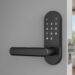 A modern smart lock with keypad is installed on partially open door, revealing bright, airy bedroom with large window view. sleek design of lock complements contemporary interior