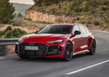 Audi Sport has pulled the wraps off the new RS5, and this one rewrites the rulebook. It replaces both the old RS4 and RS5, arrives as a sedan and Avant, and for the first time wears a plug-in hybrid badge. This is not mild electrification. It’s a full-blown performance hybrid with numbers big enough to rattle the segment. Under the hood sits a 2.9-liter twin-turbo V6, evolved from the previous RS4/RS5 unit. On its own, it delivers 503 hp and 600 Nm of torque. An electric motor integrated into the eight-speed automatic transmission adds another 174 hp and 460 Nm. Combined output stands at a formidable 630 hp and 825 Nm. That puts it well ahead of the base BMW M3 and even the BMW M3 Competition xDrive. Audi claims 0–100 km/h in 3.6 seconds. There’s also a boost function that unleashes maximum output for 10 seconds at a time. Practical family car, meet launch-control party trick. Real Electric Range, Not Just a Token The RS5 packs a 22 kWh net battery mounted under the boot floor. It supports AC charging up to 11 kW and promises up to 80 km of electric-only range. That’s a meaningful number in daily use, and far beyond what performance hybrids like the Mercedes-AMG C63 S E Performance offered in earlier iterations. In theory, you could commute silently during the week and still have 630 hp waiting for you on Sunday morning. That dual personality is clearly the brief here. Quattro, Evolved Audi hasn’t ignored handling. The Quattro all-wheel-drive system gets a new center differential designed to sharpen turn-in and reduce traditional Audi understeer. At the rear, Dynamic Torque Control uses an electromechanical torque-vectoring transaxle to distribute power between the rear wheels in milliseconds. There’s even an RS Torque Rear mode. Translation: drift mode. For a brand once stereotyped for nose-heavy handling, this is a deliberate statement. Braking hardware is equally serious. Standard steel discs measure 420 mm at the front and 400 mm at the rear. Optional carbon ceramics increase that to 440 mm and 410 mm, respectively, trimming around 30 kg in the process. The Weight Question Here’s the part that will divide opinion. The new RS5 sedan weighs 2,355 kg with the driver. The Avant adds 15 kg more. That’s roughly 550 kg heavier than the old RS4 Avant and significantly more than rivals like the BMW M5, though it undercuts that car slightly in absolute terms. In fact, the RS5 now outweighs certain versions of the Ford F-150 SuperCab. For enthusiasts who equate performance with lightness, that’s a hard pill to swallow. Still, electrification comes at a cost. Bigger batteries, added hardware, and reinforced structures all add mass. The question is whether the chassis tuning and torque vectoring can mask it on the road. Aggressive Design, Unified Identity Visually, the RS5 leans into its role as Audi’s compact performance flagship. It’s around 90 mm wider than the standard A5, wears a darker honeycomb grille, and features distinctive lighting signatures with checkered-flag detailing. At the rear, a sculpted diffuser and large matte oval exhaust tips complete the look. It certainly looks every bit the modern RS car. Now the spotlight turns to how it drives. If Audi has managed to blend electrified muscle with genuine agility, the RS5 could signal a new chapter for performance sedans and wagons. If not, critics will point to the scales and ask uncomfortable questions. Either way, the era of lightweight turbo-only RS cars is officially over.