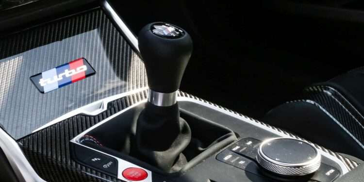 The manual gearbox isn’t dead at BMW just yet. But it’s definitely fighting for survival. Earlier this year, BMW M boss Frank van Meel stirred debate when he said manual transmissions “don’t really make sense from an engineering standpoint.” His reasoning was straightforward. Modern performance engines produce more torque than traditional manual gearboxes can reliably handle. Automatic transmissions, on the other hand, can manage higher power outputs with greater efficiency. Still, BMW isn’t ready to pull the plug completely. According to Sylvia Neubauer, Vice President of Customer, Brand, and Sales at BMW M, engineers are actively working on a solution to keep the clutch pedal alive. While she didn’t reveal specifics, her message was clear. BMW knows enthusiasts still want manuals, and the company is trying to find a way to deliver. Engineering vs Emotion The challenge is simple but difficult to solve. BMW’s signature 3.0-liter inline-six continues to gain power. As performance climbs, traditional manual gearboxes struggle to keep up. One potential workaround is already in use. BMW could limit engine torque in manual versions to preserve durability. This isn’t theoretical. The current BMW M2 already does this. The automatic version produces 50 Nm more torque than the manual variant. It’s a compromise. Drivers still get three pedals, but not the engine’s full potential. From a purist perspective, that’s still better than losing manuals entirely. Declining Demand Complicates Matters The bigger issue is demand. Manual take rates have dropped sharply across the industry. That makes it difficult for manufacturers to justify investing millions in developing new manual gearboxes. Even suppliers are hesitant. Producing low-volume transmissions doesn’t make financial sense. Without economies of scale, costs rise quickly. There’s also the reality of modern technology. Advanced driver-assistance systems are easier to integrate with automatic transmissions. As vehicles become more complex, manuals naturally become harder to support. Emissions Regulations Accelerate the Shift Stricter emissions rules are another major factor. Automatic transmissions often deliver better fuel efficiency and lower CO₂ emissions. For automakers facing tough regulatory targets, that difference matters. If automatics help reduce fleet emissions, manuals become harder to justify. This is especially true in Europe, where manufacturers face heavy fines for exceeding emissions limits. Every gram of CO₂ counts. What’s Next for BMW Manuals? Despite the challenges, BMW’s combustion-engine performance cars aren’t going anywhere just yet. The company has already confirmed a next-generation M3 with a six-cylinder engine, expected around 2028. That suggests internal combustion M cars will continue into the 2030s. But manual availability remains uncertain. The Z4 M40i manual is already being phased out. That leaves just the M2, M3, and M4 as BMW’s remaining manual offerings. These models are expected to stay in production for a few more years, giving enthusiasts a limited window. A Last Chance for Enthusiasts The reality is clear. Manuals are becoming niche products in an industry moving toward electrification, automation, and efficiency. BMW isn’t giving up yet, but the clock is ticking. For enthusiasts who still believe driving should involve three pedals and full engagement, the message is simple. If you want a manual BMW, now might be the time.